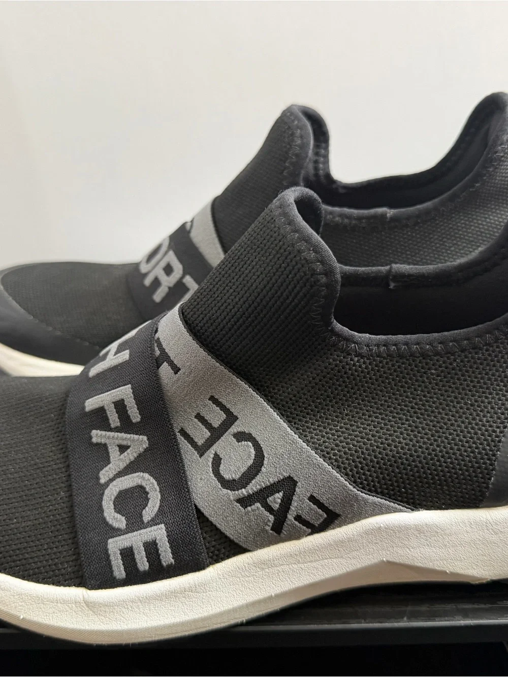 The North Face Women's Black Knit Slip-On Sneakers with Gray Branded Straps